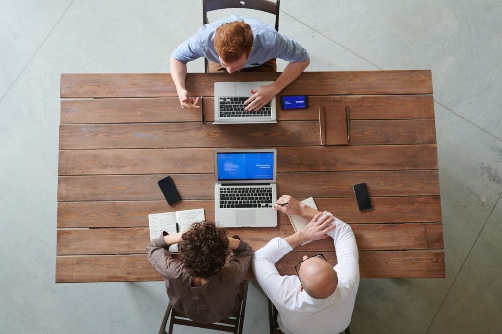 Team working with laptops and smartphones
