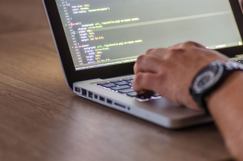 Developer coding on a laptop